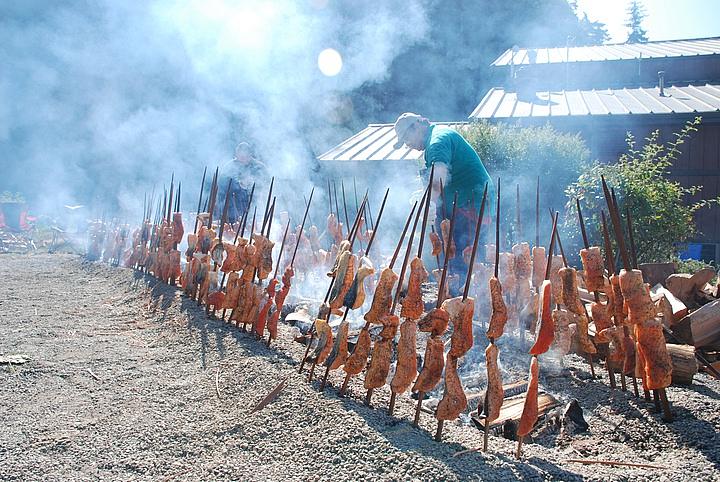 The Gensaws cook Klamath River salmon the Yurok way, on redwood sticks over an alderwood fire, at this year's Klamath Salmon Fes