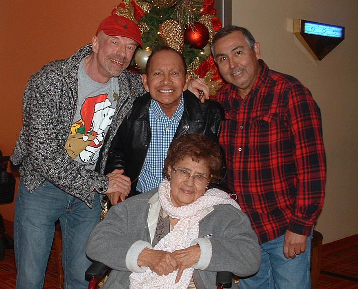 Ed Harbur, Dave Gonzalez and Gustavo “Sky” Gonzalez with the Gonzalez’s mother, Evangelina. Evangelina became infected with COVI