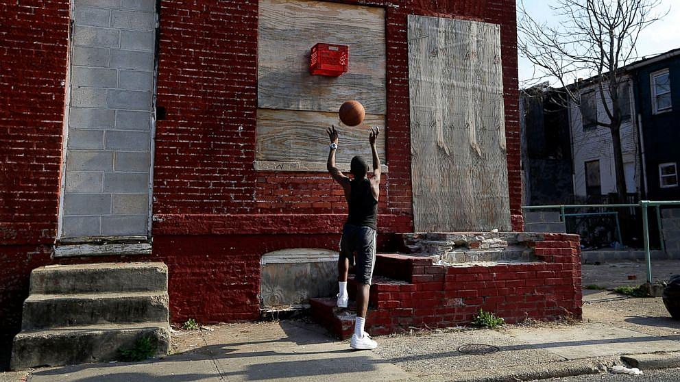 A boy shoots a basketball into a makeshift basket made from a milk crate and attached to a vacant row house in Baltimore, April 8, 2013. Patrick Semansky/AP Photo A boy shoots a basketball into a makeshift basket made from a milk crate and attached to a vacant row house in Baltimore, April 8, 2013. Patrick Semansky/AP Photo