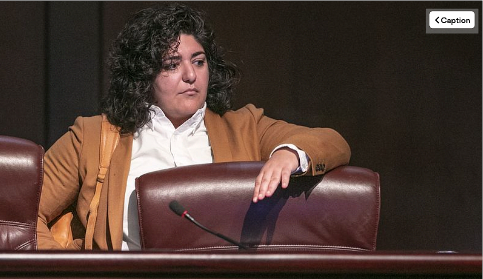 Council member Liliana Bakhtiari prepares to take her seat on the dais as the Atlanta City Council held their first in person me