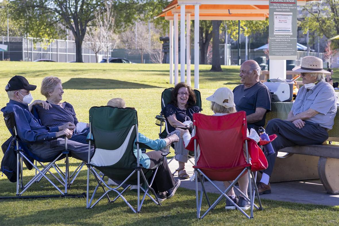 A group of seniors from Oakland and Walnut Creek hangs out at Heather Farm Park in Walnut Creek, Calif., on Feb. 10, 2022.