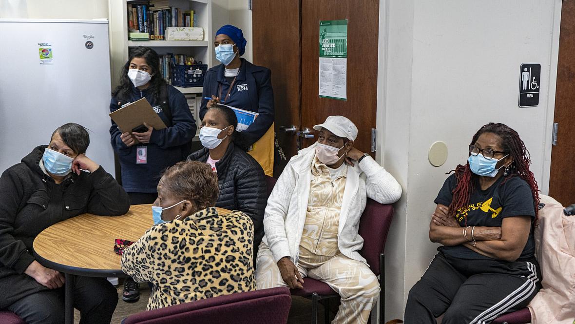 Community members listen to VCU Massey Cancer Center Director Robert Winn during his district walk in late March in Highland Springs, Va. Community members listen to VCU Massey Cancer Center Director Robert Winn during his district walk in late March in Highland Spr
