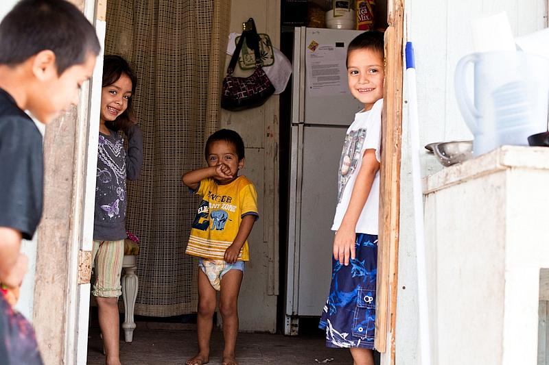 Four of the five children who live in this dilapidated one-room home in Mexico Chiquito, a colonia in the Rio Grande Valley.