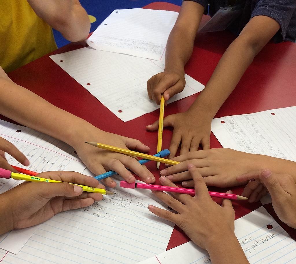 Kids at Schaefer Elementary write their poems.