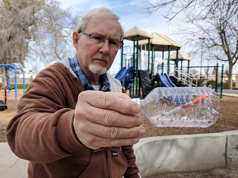 Oildale Community Action Team director Dave Kadel stands with a hypodermic needle he found. Oildale Community Action Team director Dave Kadel stands with a hypodermic needle he found.