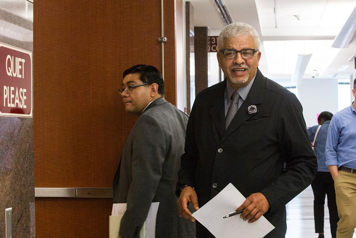 Attorney Oliver Sprott heads into a courtroom at the Harris County Juvenile Justice Center. Sprott was appointed to represent lo