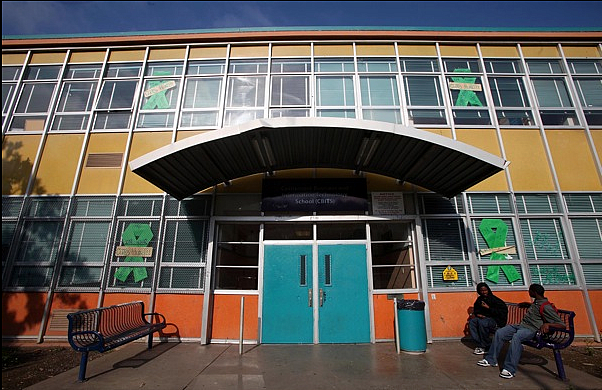 Students sit in front of Castlemont Business Information Technology School in Oakland, Calif. Students sit in front of Castlemont Business Information Technology School in Oakland, Calif.