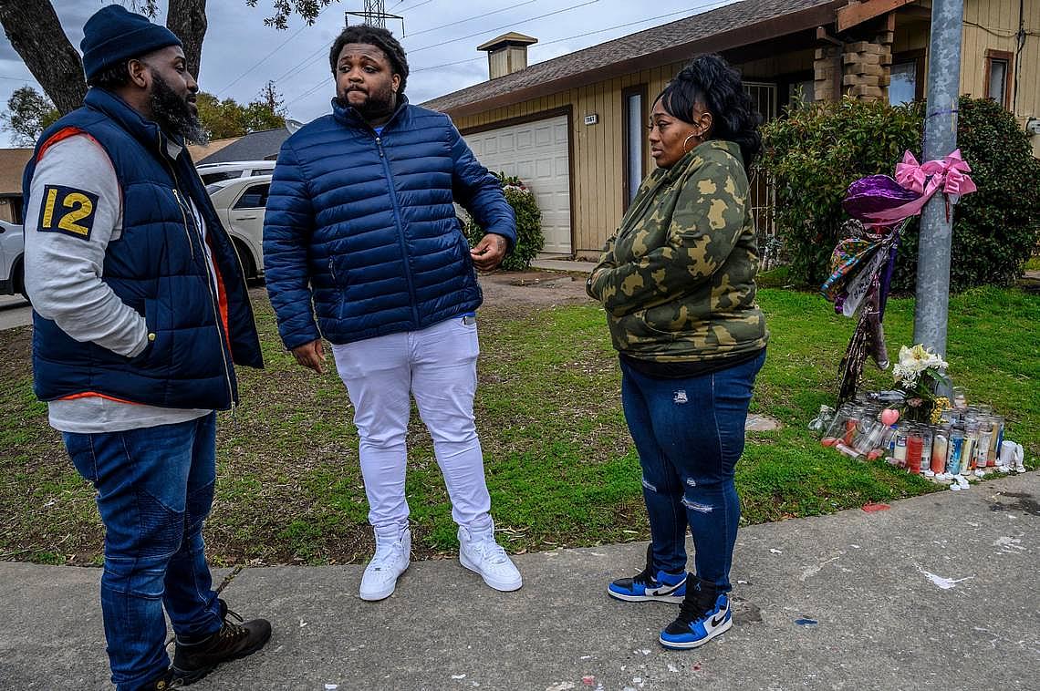 Berry Accius visits Dajha Richards’ mother and step-father near a memorial for Dajha, who was shot and killed.