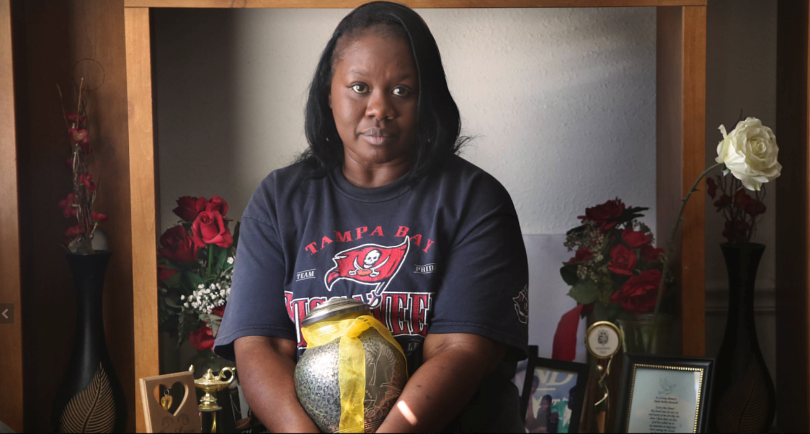 Patricia Davis, mother of Ikeim Boswell, holds the urn with her son’s ashes in her Tampa home. Ikeim was 16 on March 14, 2015, w
