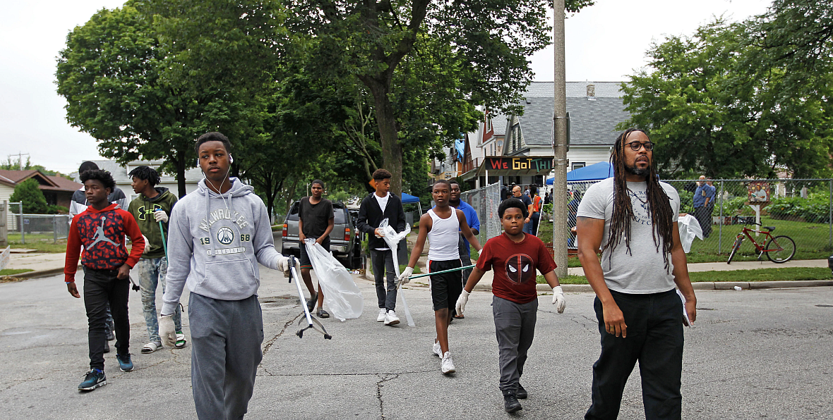 James E. Causey (right), a Milwaukee Journal Sentinel reporter, spent the summer of 2018 following boys as they participated in 