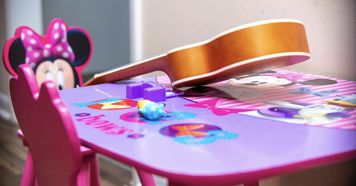 Nadia's Minnie mouse play table, with a small guitar on it. Nadia's Minnie mouse play table, with a small guitar on it.