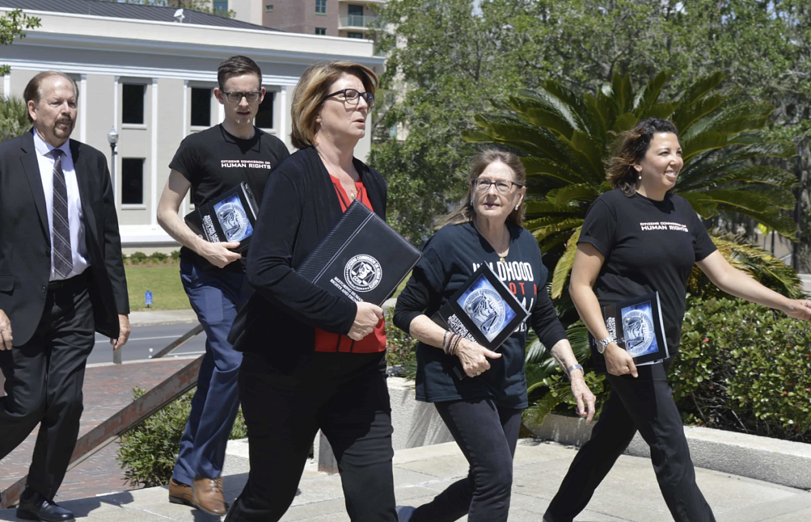 Diane Stein, center, and members of her organization Citizens Commission on Human Rights, have been working for years to advocat