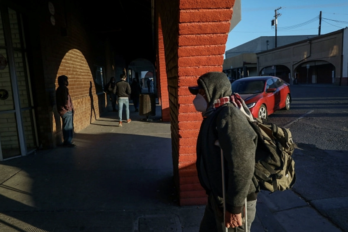 People walk into downtown Calexico after crossing the United States-Mexico border on December 1, 2020. 