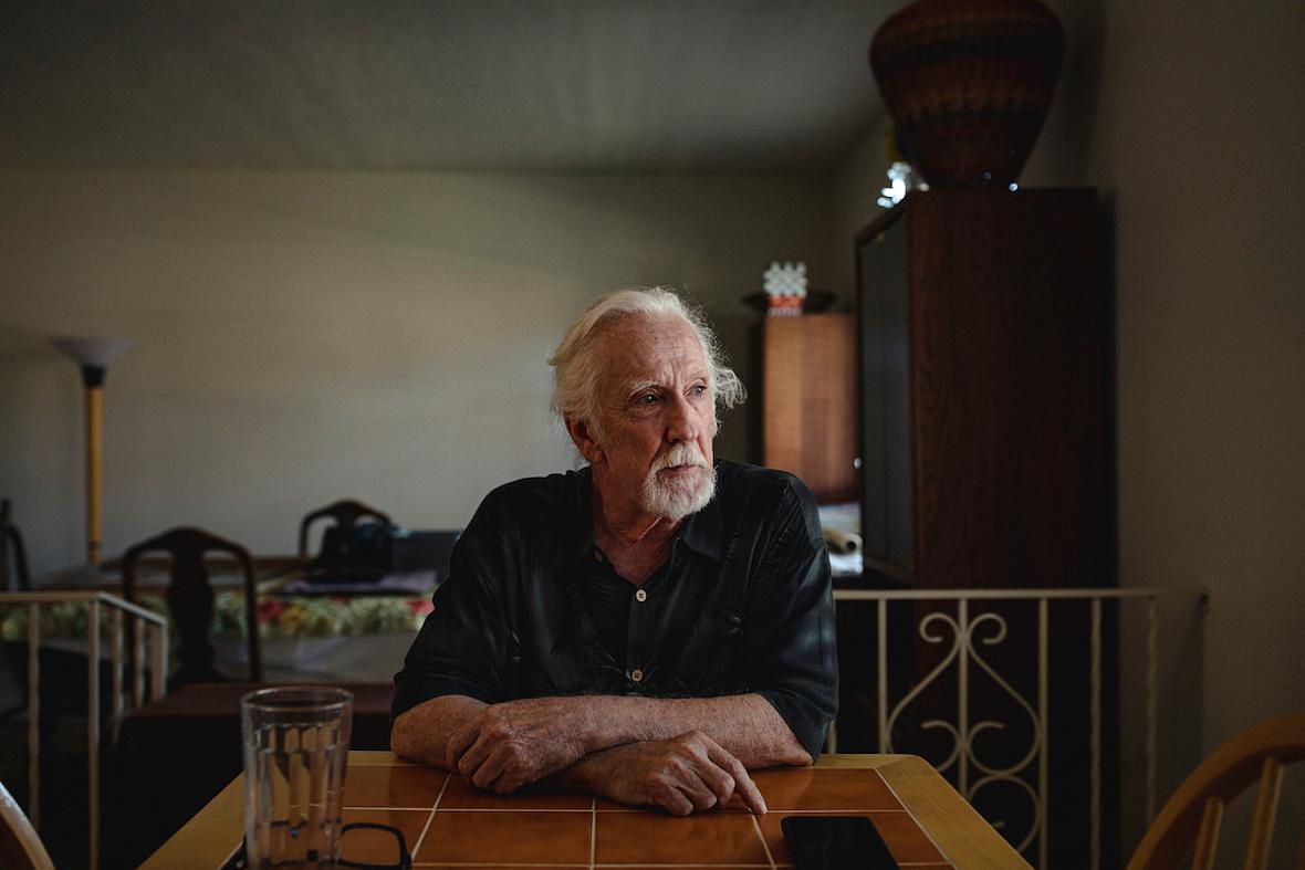 Steve Harbin sits at his dining room table at his home in Albuquerque.