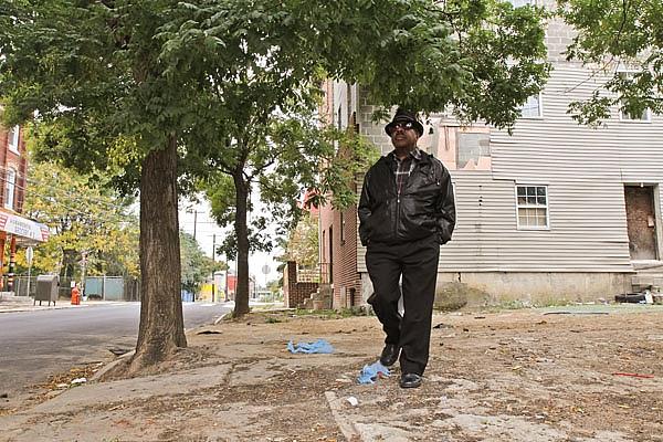Andre Mears says he is aware of a bit of drug activity in the neighborhood but refuses to let himself be kept indoors. (Kimberly Paynter/for NewsWorks) 
