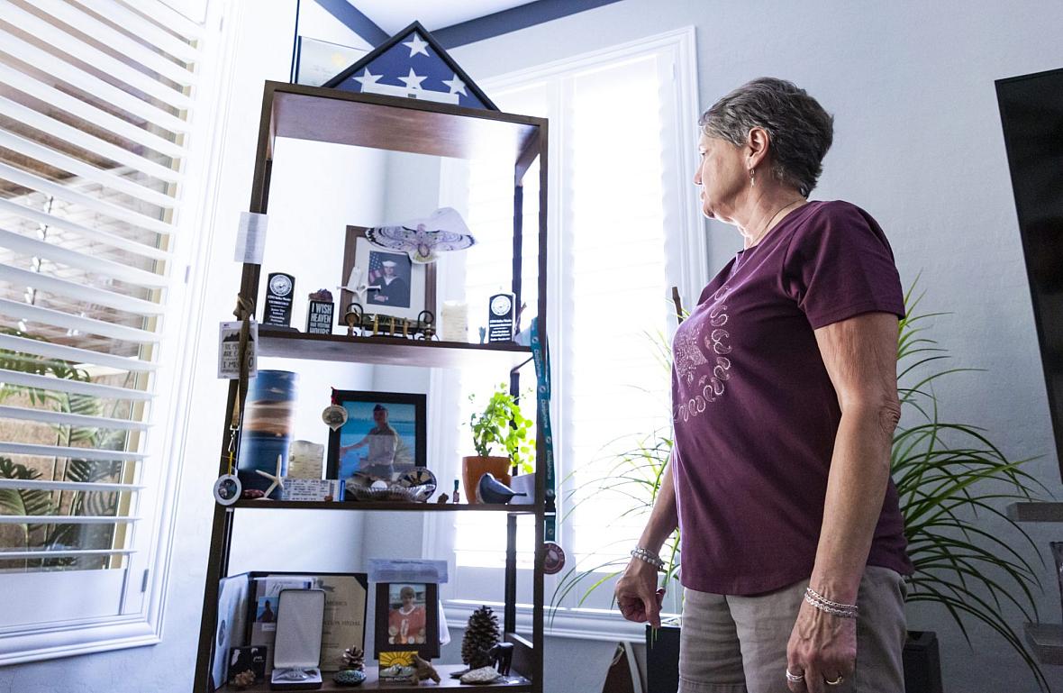 Jodee Watelet looks at a shelf dedicated to her son, Kellen Watelet, in her home in Mesquite, Nev., on Friday, May 20, 2022.
