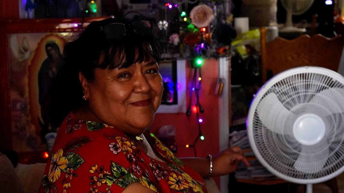 Blanca Gomez sits inside her trailer home in Cantua Creek, an unincorporated community in Fresno County, on Aug. 19, 2022. Despi