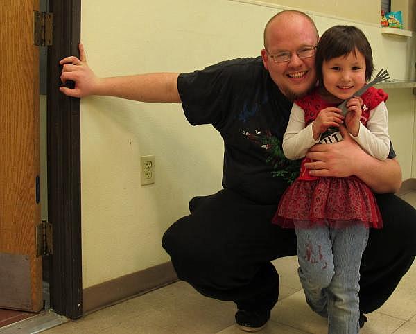 Four-year-old Alyson Potter with dad, Anthony Potter, Cheyenne River Youth Project youth programs assistant (Stephanie Woodard)