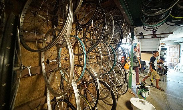 Before COVID-19 started spreading in Hawaii, kids worked on their bikes at KVIBE in Kalihi. The bike shop became a food hub when