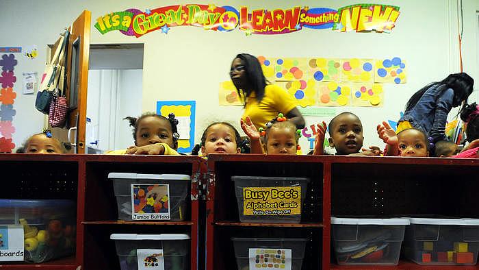 Lloyd Fox / Baltimore Sun Children wait for their next activity at Little Flowers Child Development Center. Located in the Upton/Druid Heights neighborhood, many of the children at Little Flowers are exposed to a variety of stressors, whether inside or outside the home, including violence.