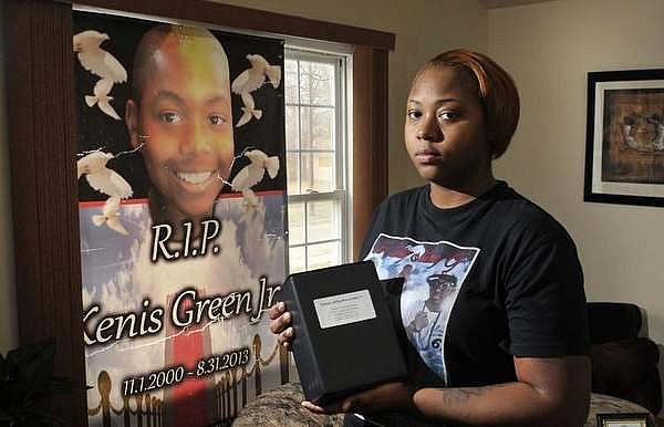 Sunsearae 'Lo Lo' Hall, mother of Kenis Green Jr., holds her son's ashes. Kenis was 12 when he was shot and killed on his front porch. Max Ortiz / The Detroit News  