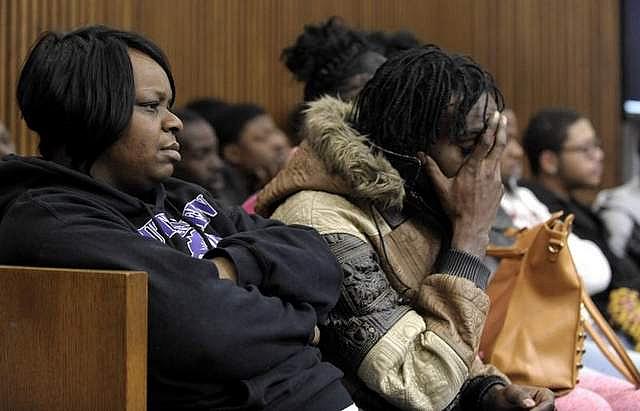 Lyvonne Cargill, left, listens with family members and friends on Thursday at the trial of Chauncey Owens and Charles Jones, who are accused of killing 17-year-old Je'Rean Blake Nobles. (Todd McInturf / The Detroit News)