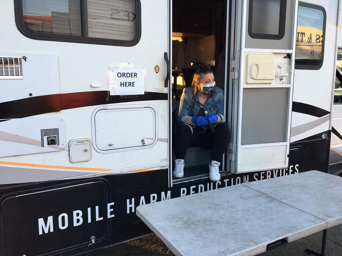 Michaella Jones hands out sterile supplies from the HEPPAC mobile outreach vehicle in April 2020.