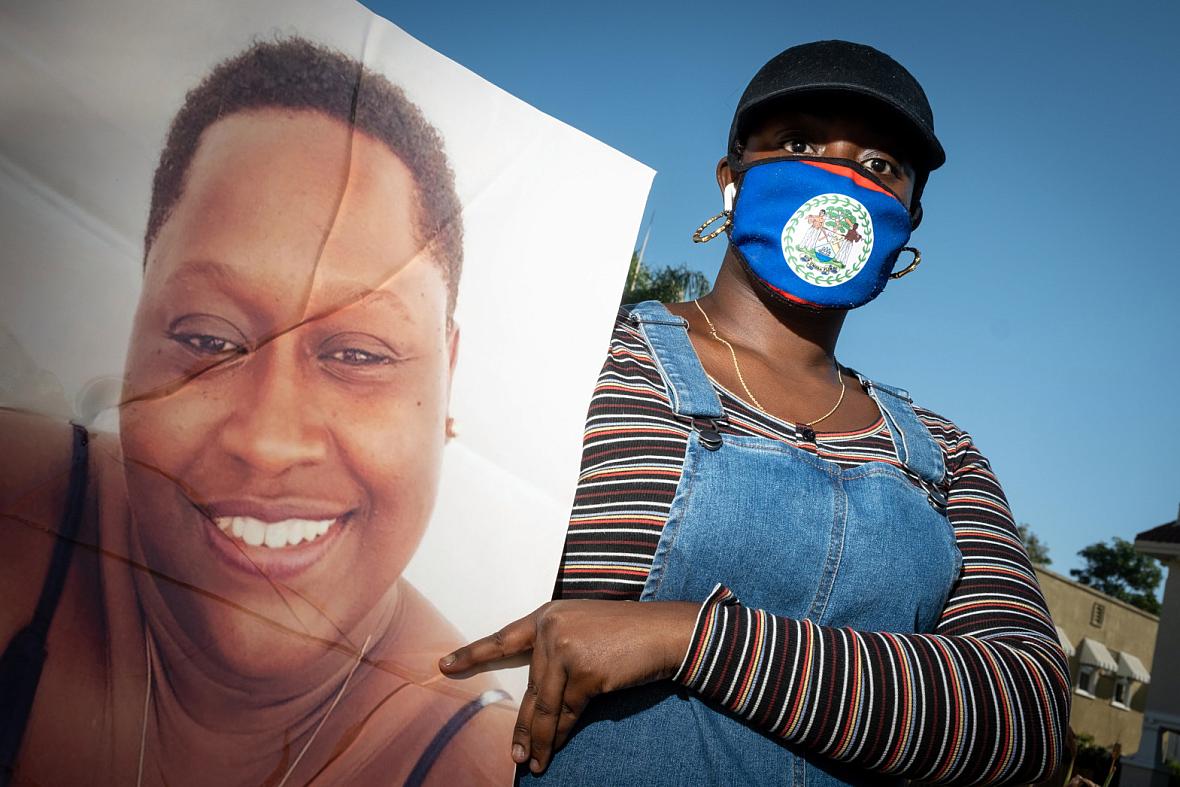 Courtney Milliner holds a photo of her mother, Eyvette Pascascio, who passed away from COVID-19. Her mother was a devoted single mother and a healthcare worker at Country Villa Terrace Healthcare Center on West Pico Boulevard in Los Angeles. Courtney Milliner holds a photo of her mother, Eyvette Pascascio, who passed away from COVID-19. Her mother was a devoted single