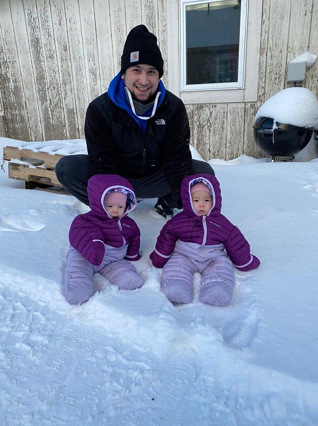 Twins Anna and Mila with their father, John Melovidov, in St. Paul. 