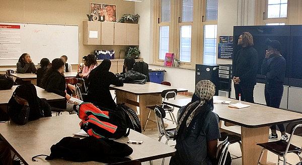 Hope Smith, 15, and Yondez Webb, 18, lead a group of their peers at Cleveland School of Science and Medicine recently in a conve