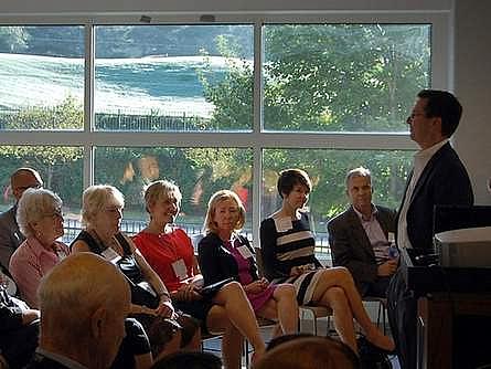 Greg Giornelli, president and CEO of Purpose Built Communities, addresses a crowd in East Lake, Atlanta. Behind him is the golf course adjacent to the Drew Charter School and East Lake Village apartments, a mixed-income neighborhood that Spartanburg leaders are hoping to use as a template as they plan and engage residents in a massive redevelopment of the Northside neighborhood.