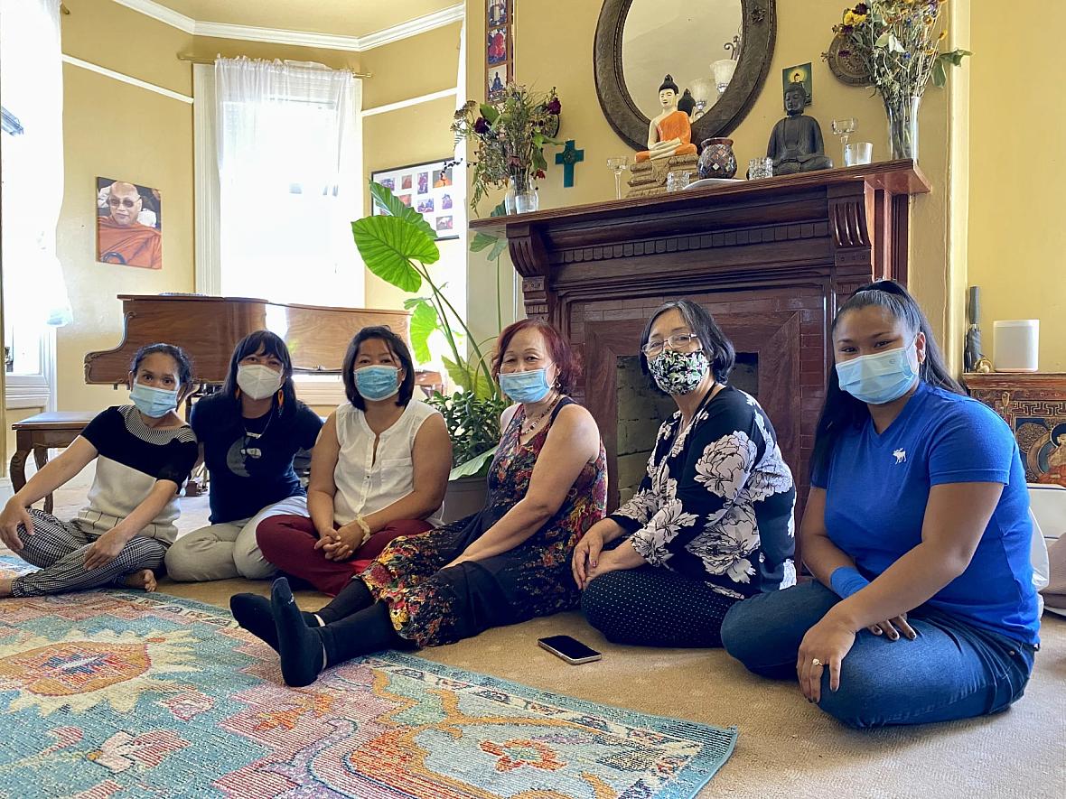 Staff members and clients on Clinic Day at the Center for Empowering Refugees and Immigrants (CERI), June 14 in Oakland, Calif.