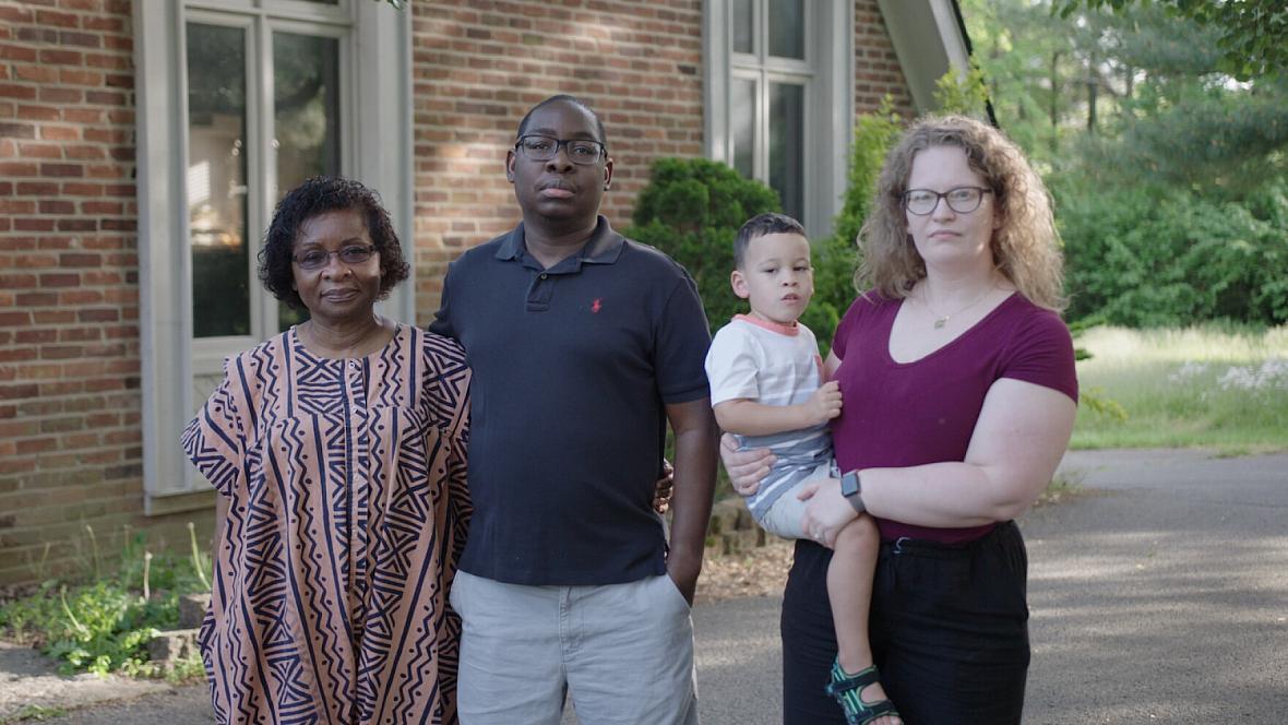 Paul Gakpo (second from the left) lives in Kentucky with his wife, Michelle (far right) and son, Louis. The family poses for a p