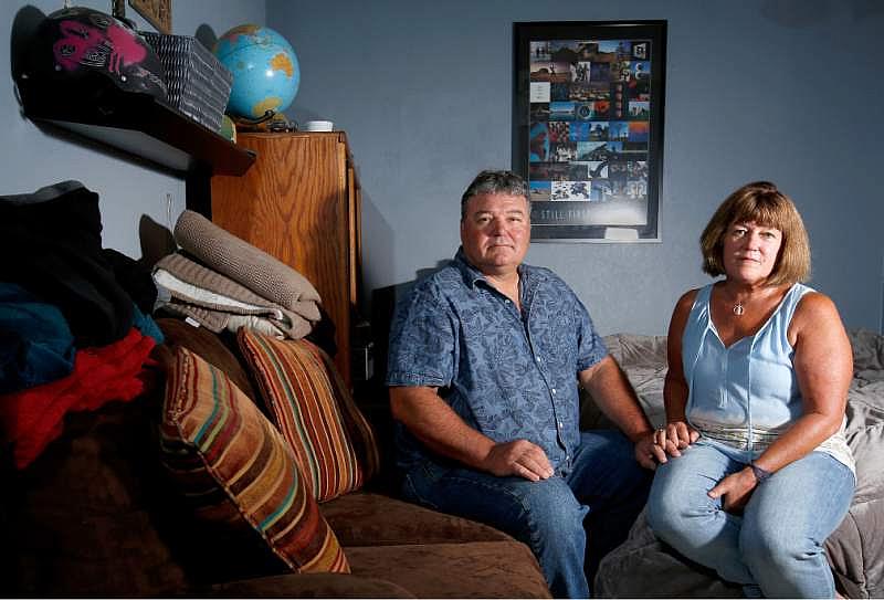 Eric and Connie Petereit pose for a portrait in their son's bedroom, at their home in Healdsburg, California on Thursday.