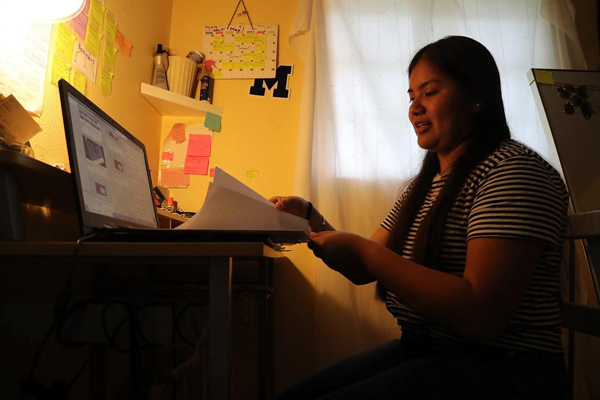 Luz Vazquez Hernandez talks about the papers she wrote for scholarships for college. Vazquez, 18, is the daughter of farmworkers