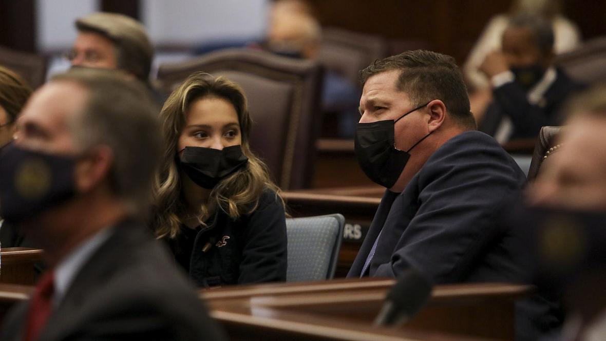 State Sen. Jeff Brandes, R-St. Petersburg, and his daughter listen to opening remarks on the first day of the 2021 legislative s