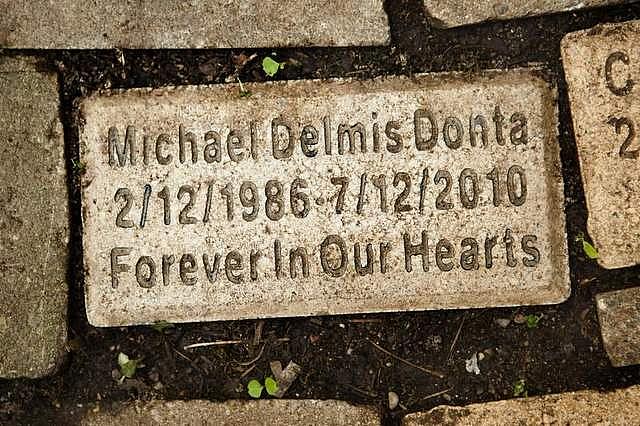 The name of Mike Donta's son, Michael Delmis Donta, is engraved on one of the bricks at the children's memorial.