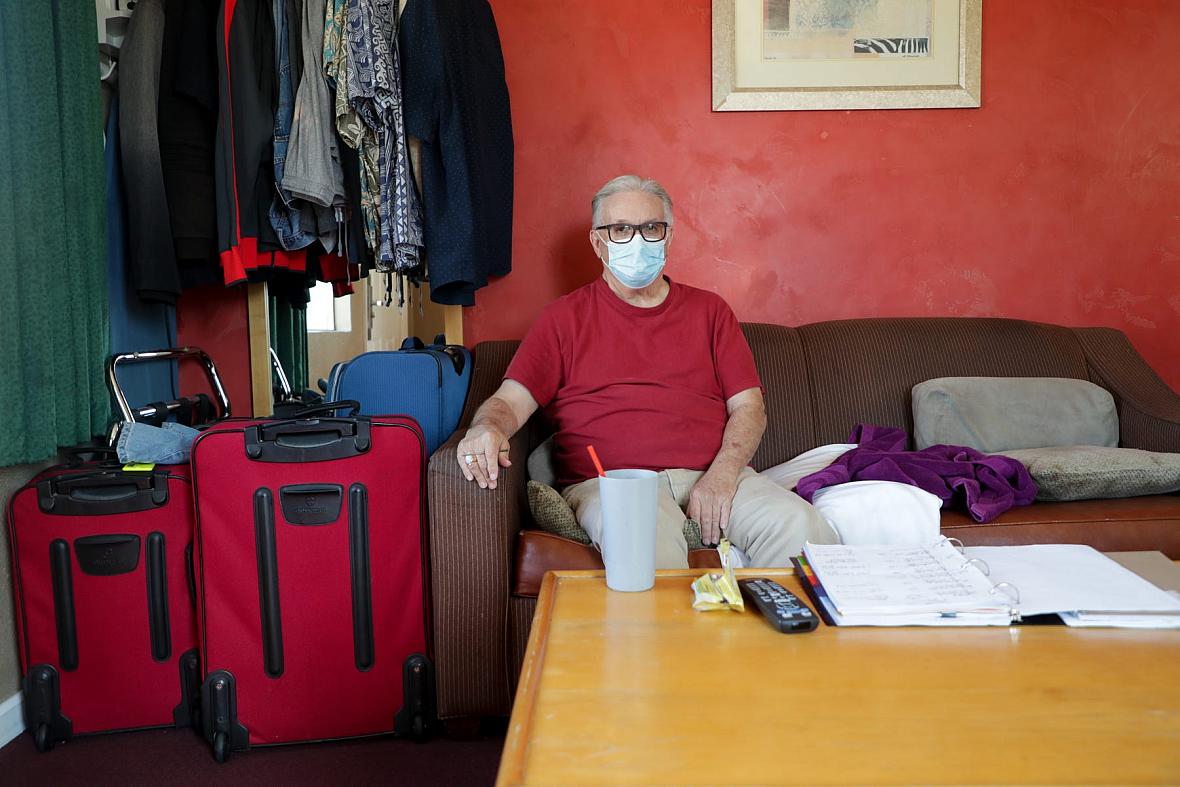 Lee Fournier sits in his hotel room provided by Project Roomkey on Sunday, October 11, 2020, at Rodeway Inn & Suites in Indio, C
