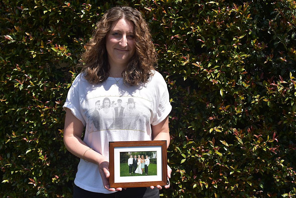 Santa Barbara resident Ashleigh Shue, daughter of Joseph Richard Sizoo II, with a family photograph taken 