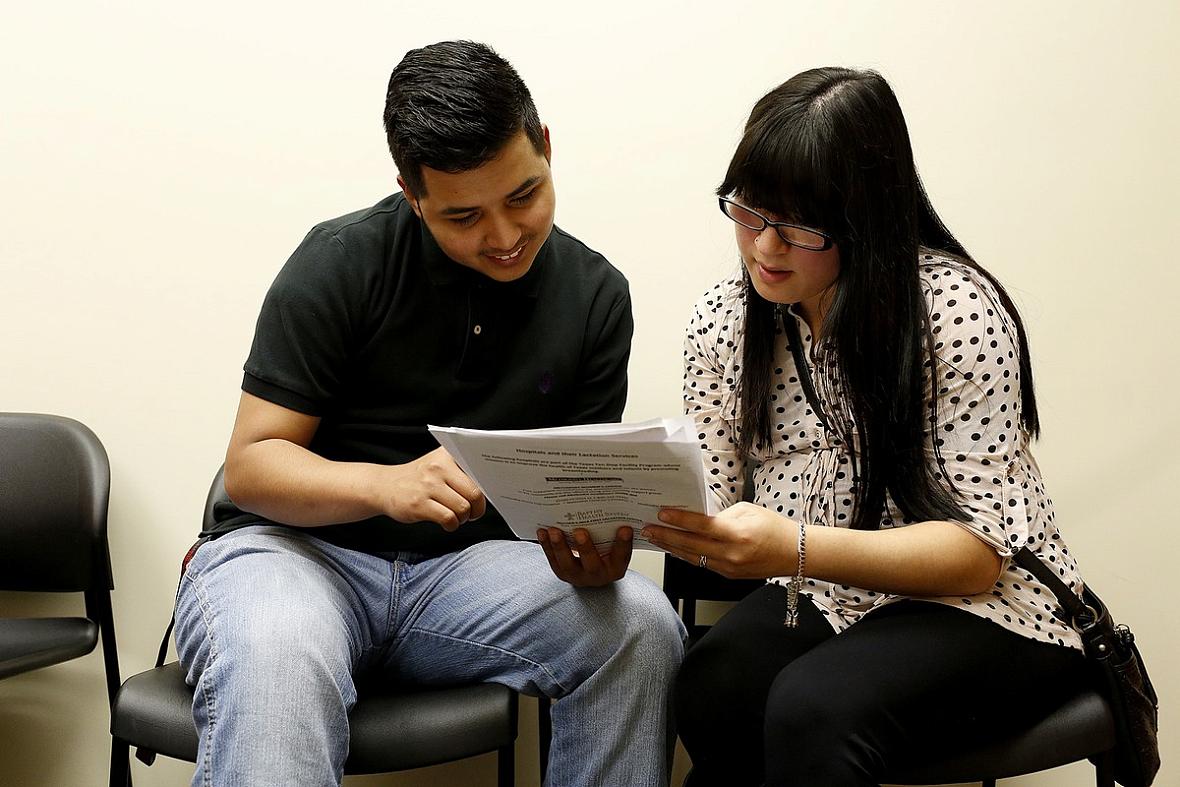 Expectant parents Richard DeLeon Jr. and his girlfriend, Faith Garcia, play a game during a Stork's Nest class in Converse on Dec. 15. The class focused on newborn care. Stork’s Nest volunteers educate expectant parents in an effort to prevent premature births and infant deaths.