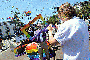 Natalie Summers from Openhouse, right, took a photo of Sister Rose Mary Chicken and E.J. Hebert in Jane Warner Plaza.