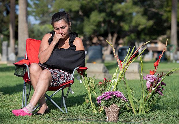 Maria Sura visits the grave of her son, Edgar Omar Sura, who was gunned down by gang members in 2012 when he was 20. Police say Sura was not in a gang. More than five years later, Maria says she would not wish her pain on anyone. She visits the Santa Ana cemetery almost daily where she sits and cries. (Photo by Mindy Schauer, Orange County Register/SCNG) Photo by Mindy Schauer, Orange County Register/SCNG