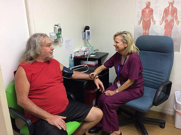Kim Harden takes a patient's blood pressure at the Lake Wales Free Clinic. Julio Ochoa/WUSF