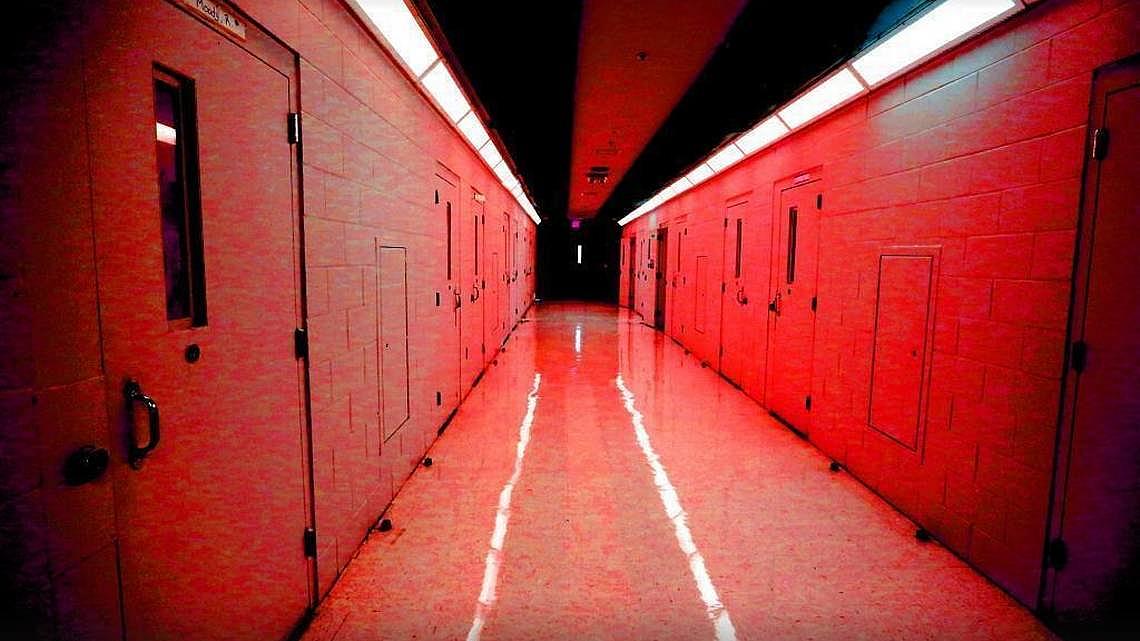 In this photo illustration, a hallway of cells is shown at the Palm Beach Youth Academy in West Palm Beach. Emily Michot 