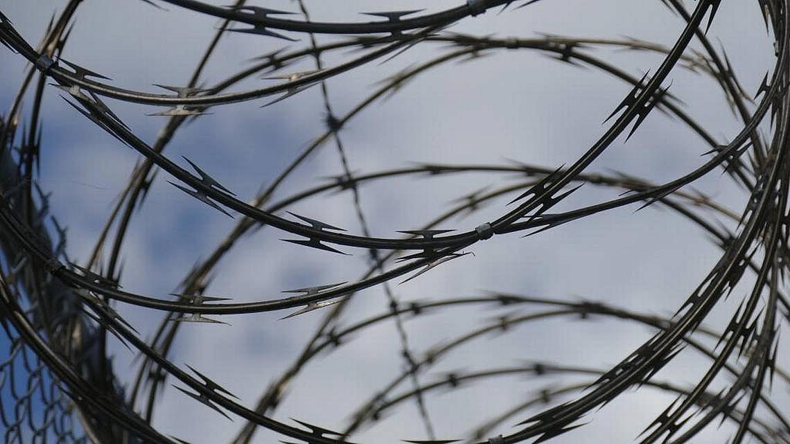Razor wire surrounding the Palm Beach Youth Academy in West Palm Beach. Emily Michot