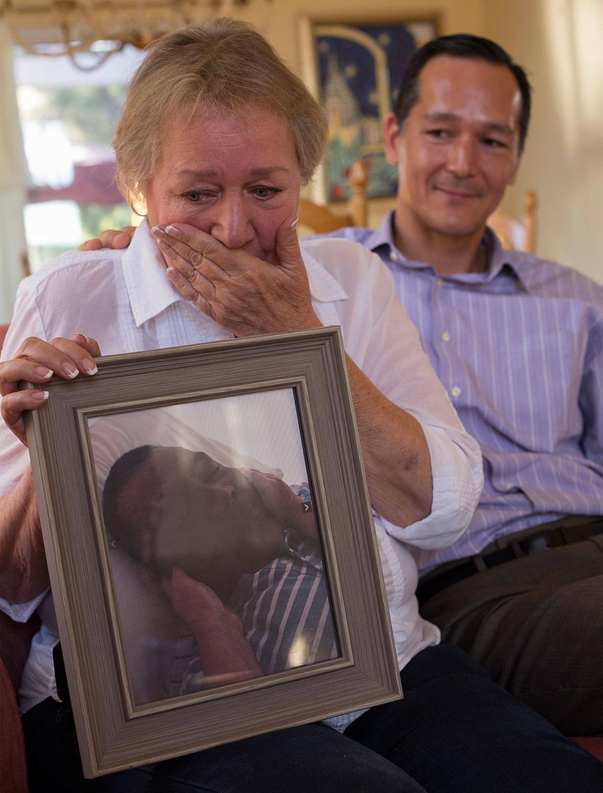 Rochelle Nishimoto recounts the death of her son Jason with her other son Adrian. (Lisa Pickoff-White/KQED)