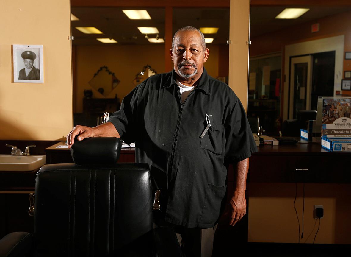 Walter Shearin talks with his customers about prostate cancer at his store, Walt's Diversity Barber Shop, in Roanoke Rapids.