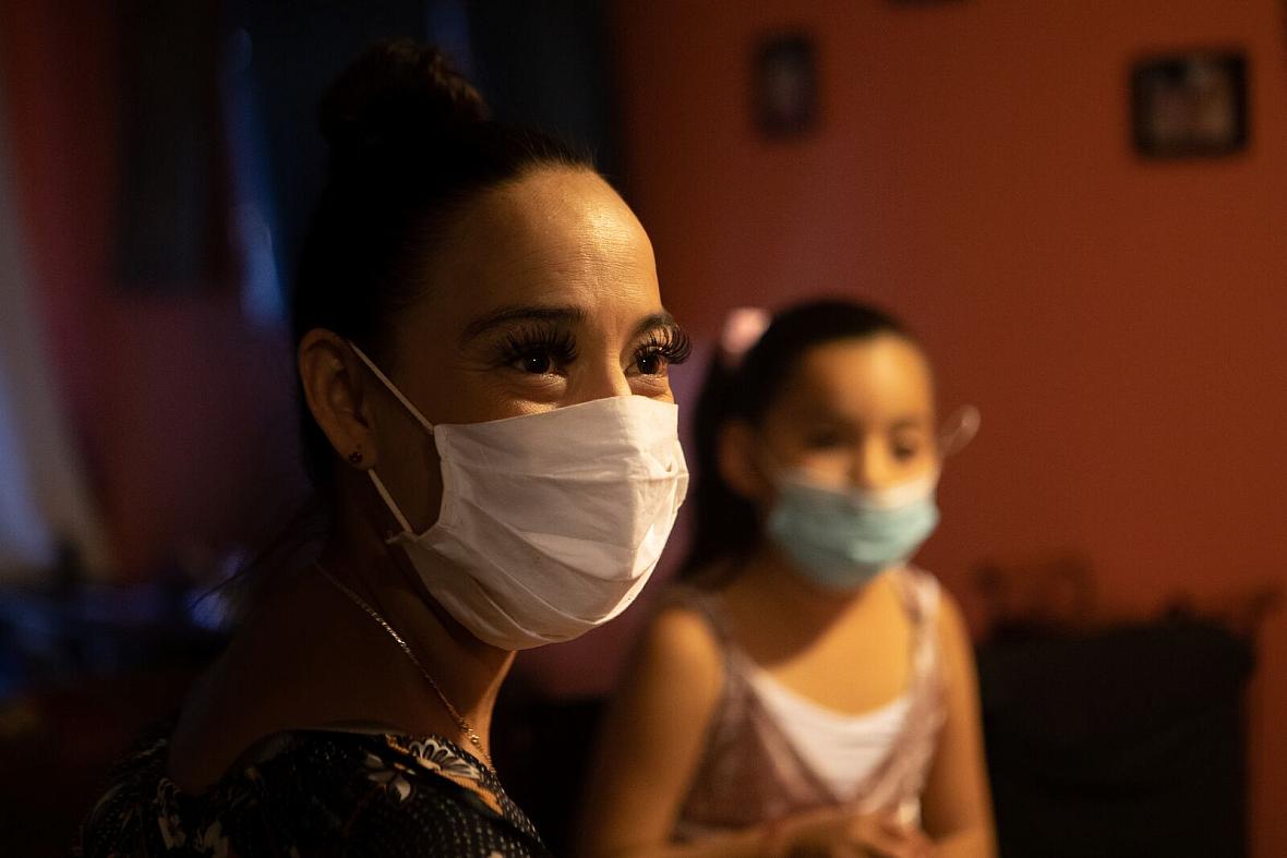 Guadalupe Muñoz with her daughter Carla in their East Oakland apartment. 