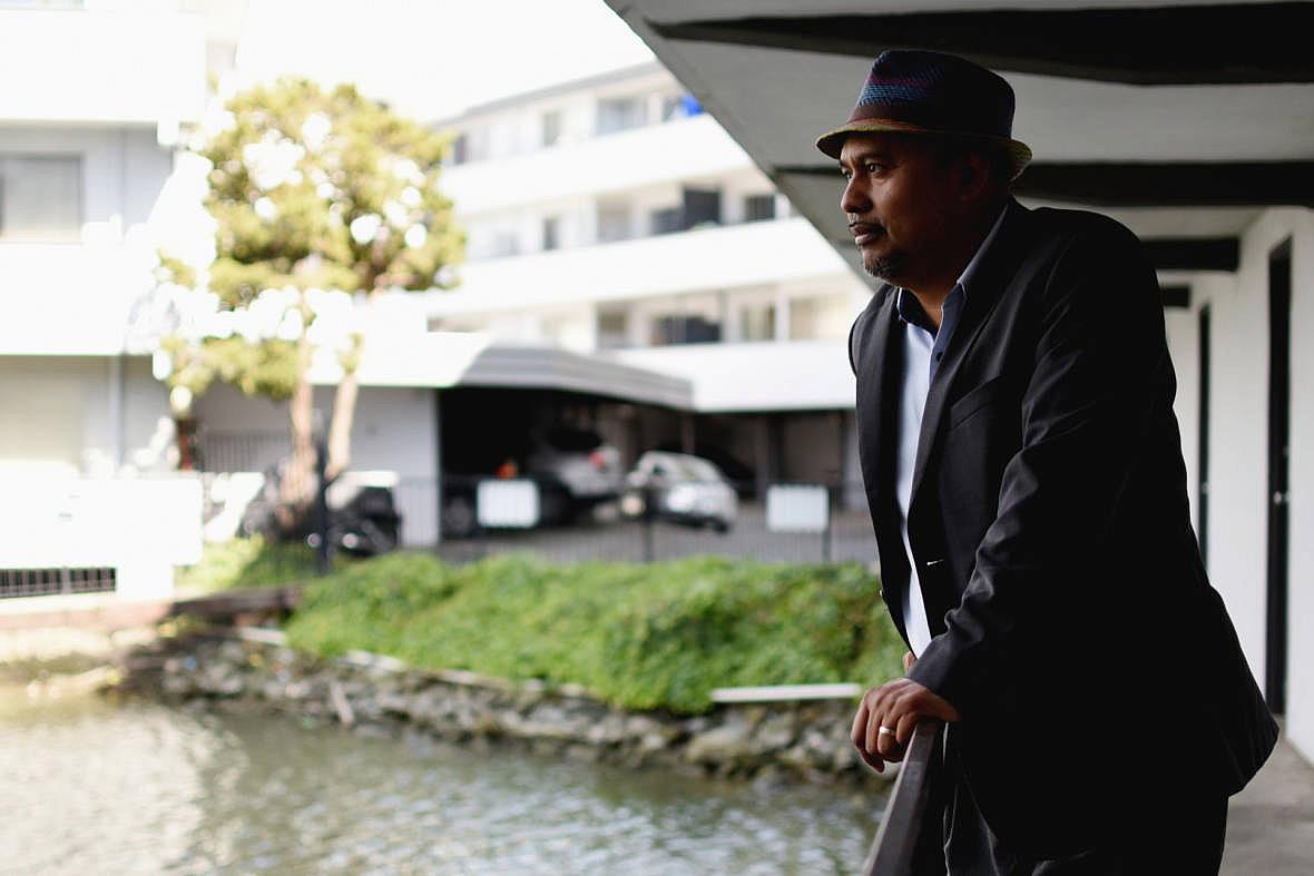 Douglas Mundo, co-director of Shore Up Marin, at an apartment complex on the San Rafael canal, which is vulnerable to sea level rise. (Photo: Lauren Hanussak/KQED) Douglas Mundo, co-director of Shore Up Marin, at an apartment complex on the San Rafael canal, which is vulnerable to sea level
