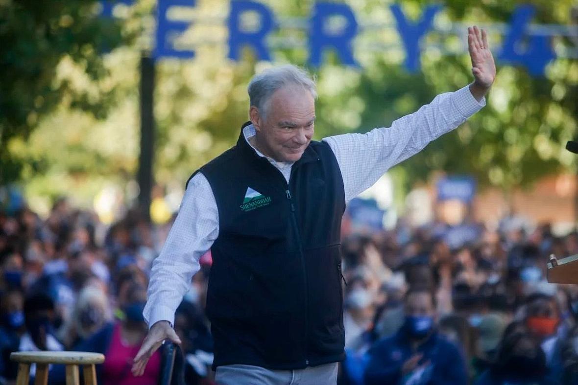 U.S. Senator Tim Kaine waives after giving remarks during a rally on Saturday, October 23, 2021 at James Branch Cabell Library i